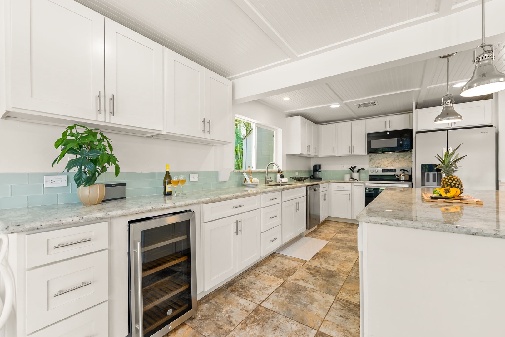 Honolulu Vacation Rentals, Ho'okipa Villa - Your dream vacation kitchen awaits, featuring sparkling granite counters, fresh coastal vibes, and everything you need to cook up island memories. Notice the wine fridge—perfect for sunset toasts!