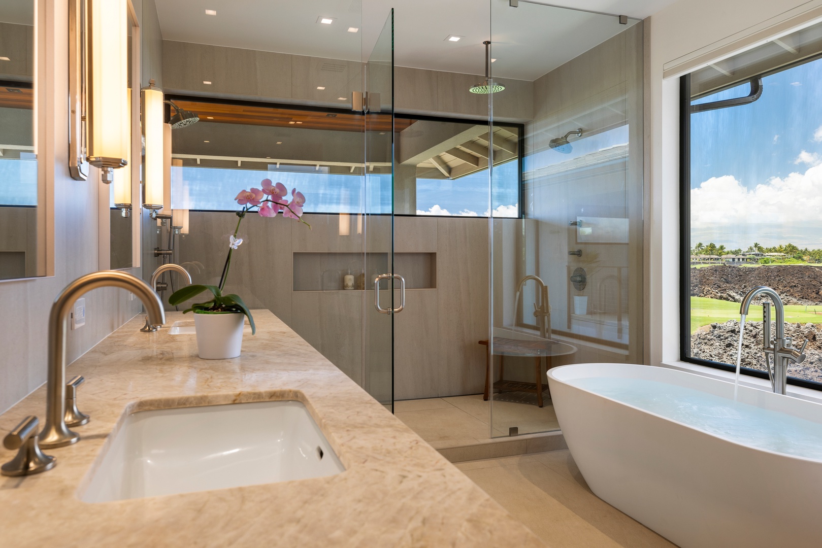 Kamuela Vacation Rentals, 6BD Mauna Lani Lux Golf Estate (5) at One Ocean - Unwind in the spa-inspired primary bath with dual vanities, a soaking tub, and walk-in shower.