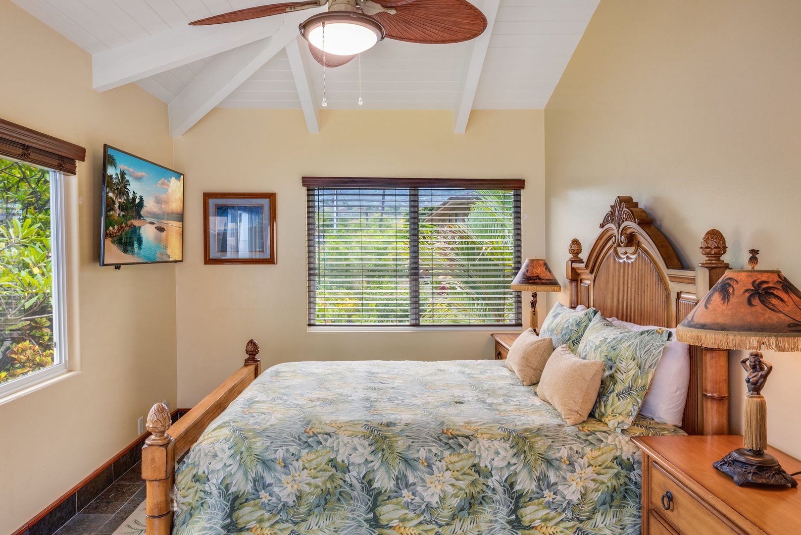 Kailua Kona Vacation Rentals, Kona Beach Bungalows** - Experience comfort in the Moana Hale Upstairs Queen room, complete with a shared bath and sweeping views.