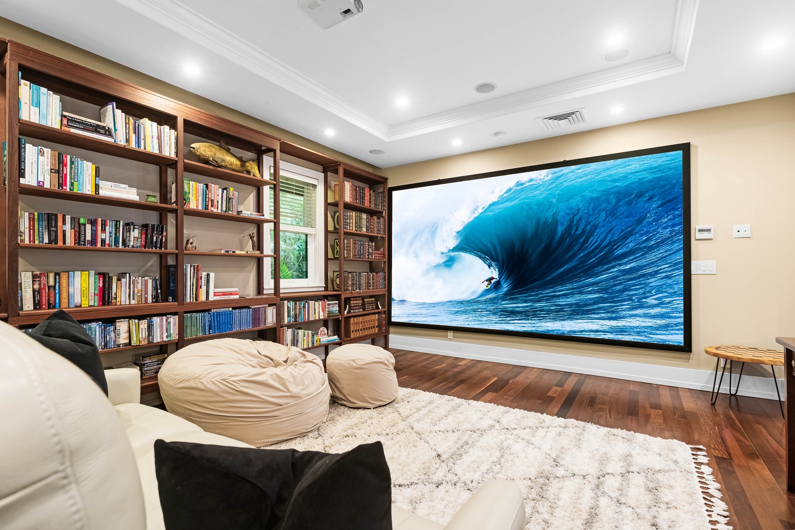 Honolulu Vacation Rentals, Pili Pono - Media library with a 150" screen and cozy bean bags for movie nights in.
