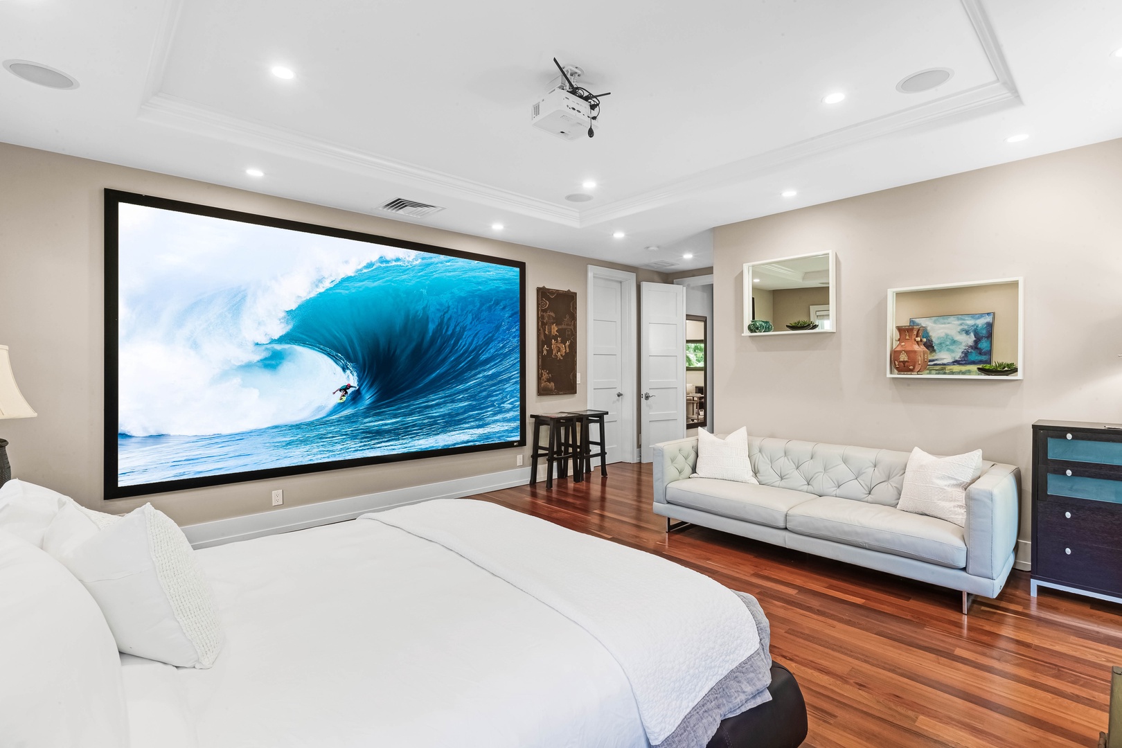 Honolulu Vacation Rentals, Pili Pono - Spacious guest suite with a king bed and in-room theater projection.
