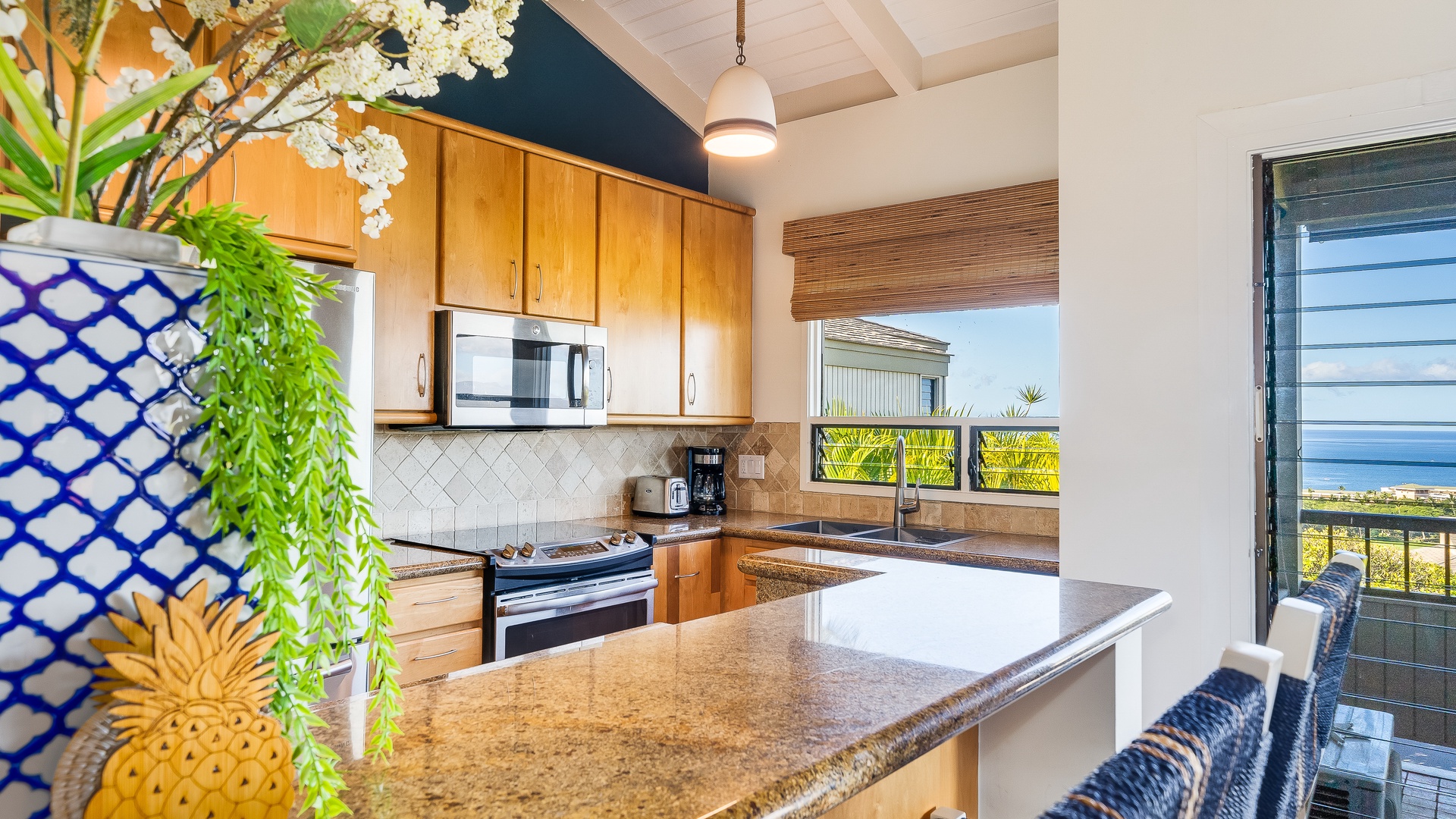 Kihei Vacation Rentals, Wailea Ekolu 1106 - A fully equipped kitchen with modern appliances and a spacious countertop, perfect for meal preparation.A fully equipped kitchen with modern appliances and a spacious countertop, perfect for meal preparation.