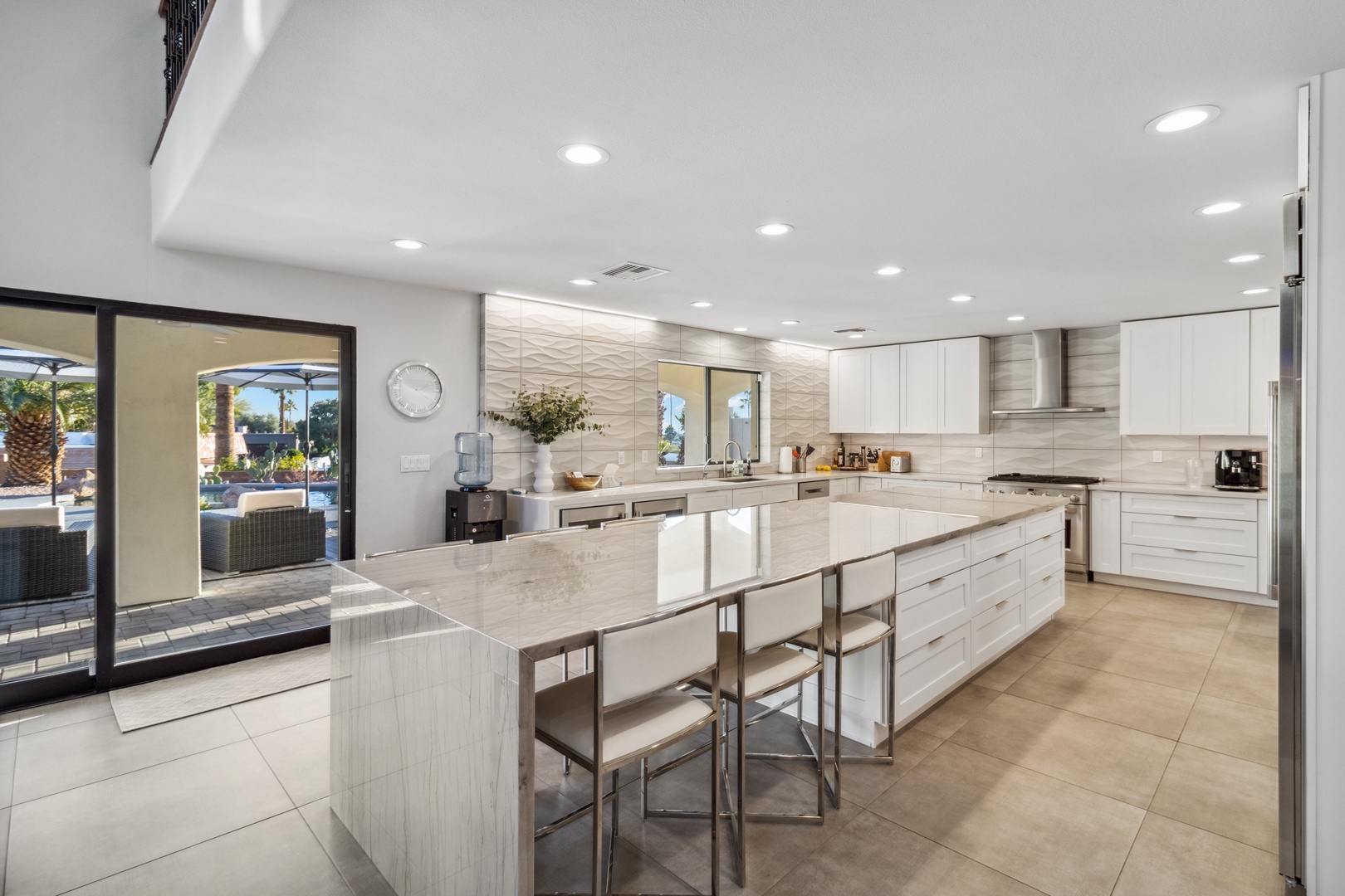 Phoenix Vacation Rentals, Majestic Mountain Views at Piestewa Peak Paradise - The modern kitchen is equipped with top-of-the-line stainless steel appliances to make your stay enjoyable. A large island includes seating for six and provides plenty of room for entertaining