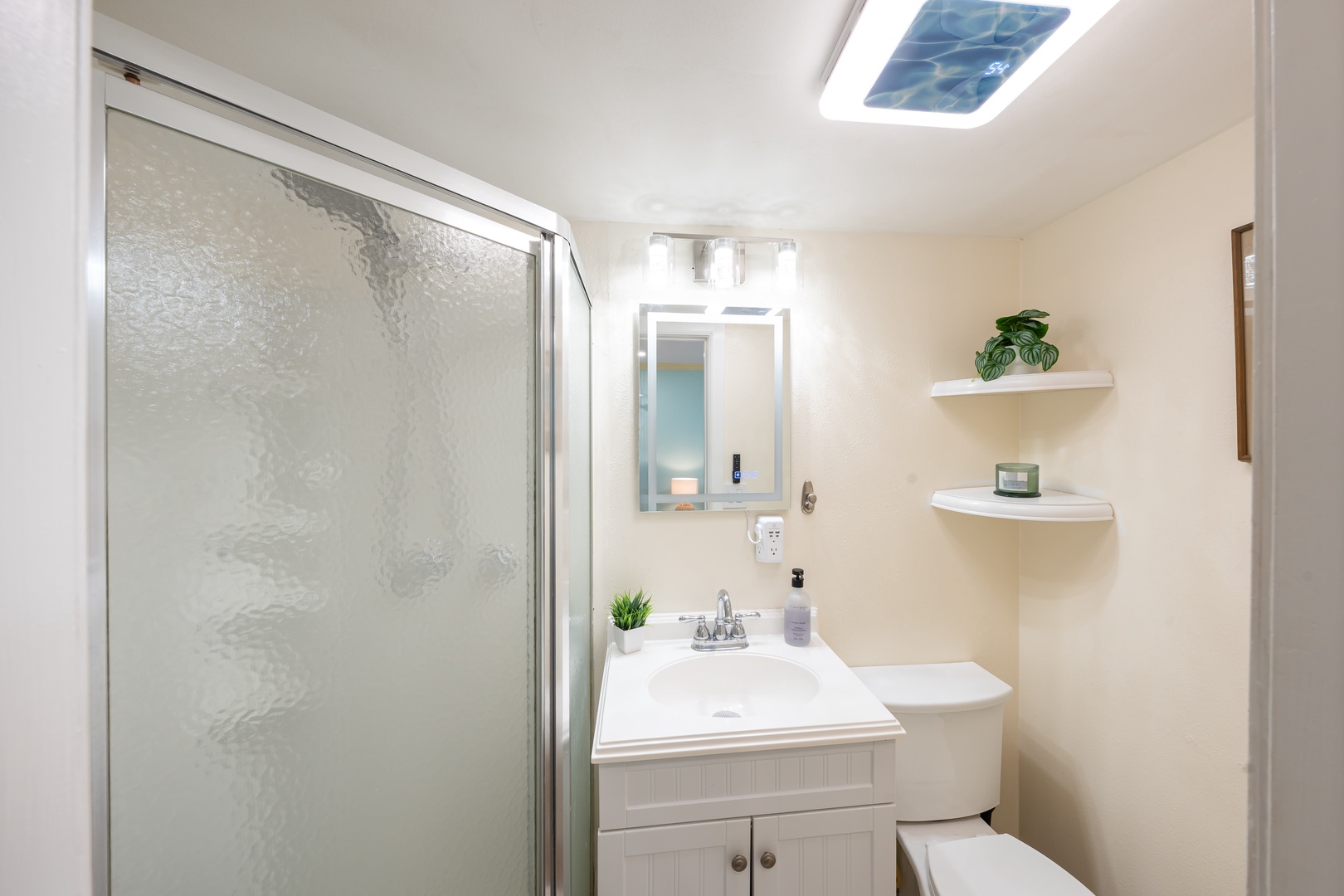 Hauula Vacation Rentals, Private Beach Paradise - Bright light over the glass shower and vanity, clean and simple.