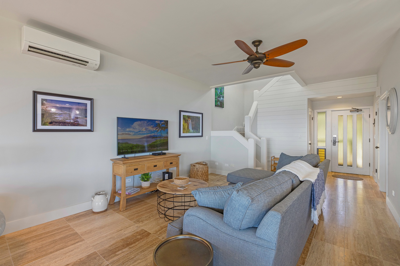 Lahaina Vacation Rentals, Kapalua Ridge 1622 - The living area offers a comfortable setting with a cozy sectional sofa and entertainment center, perfect for unwinding