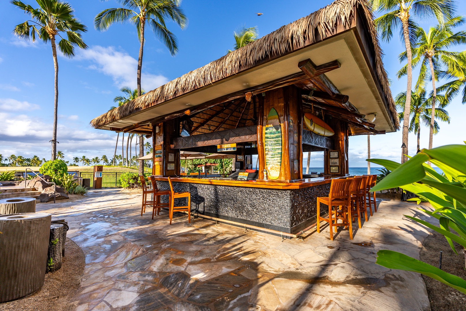 Pull up to the thatched bar for an afternoon round by the water.