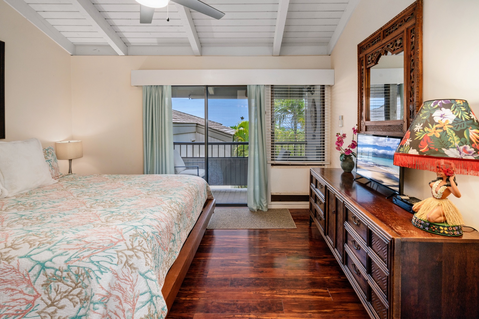 Kihei Vacation Rentals, Wailea Ekolu 204 - Rattan textures and a carved mirror give this bedroom a warmth that feels like home, not a rental.