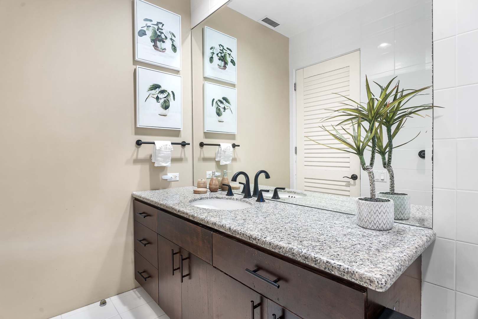 Kailua Kona Vacation Rentals, Hale Nai'a - Refresh in your beautifully appointed bathroom featuring granite countertops, elegant botanical artwork, and thoughtful touches.