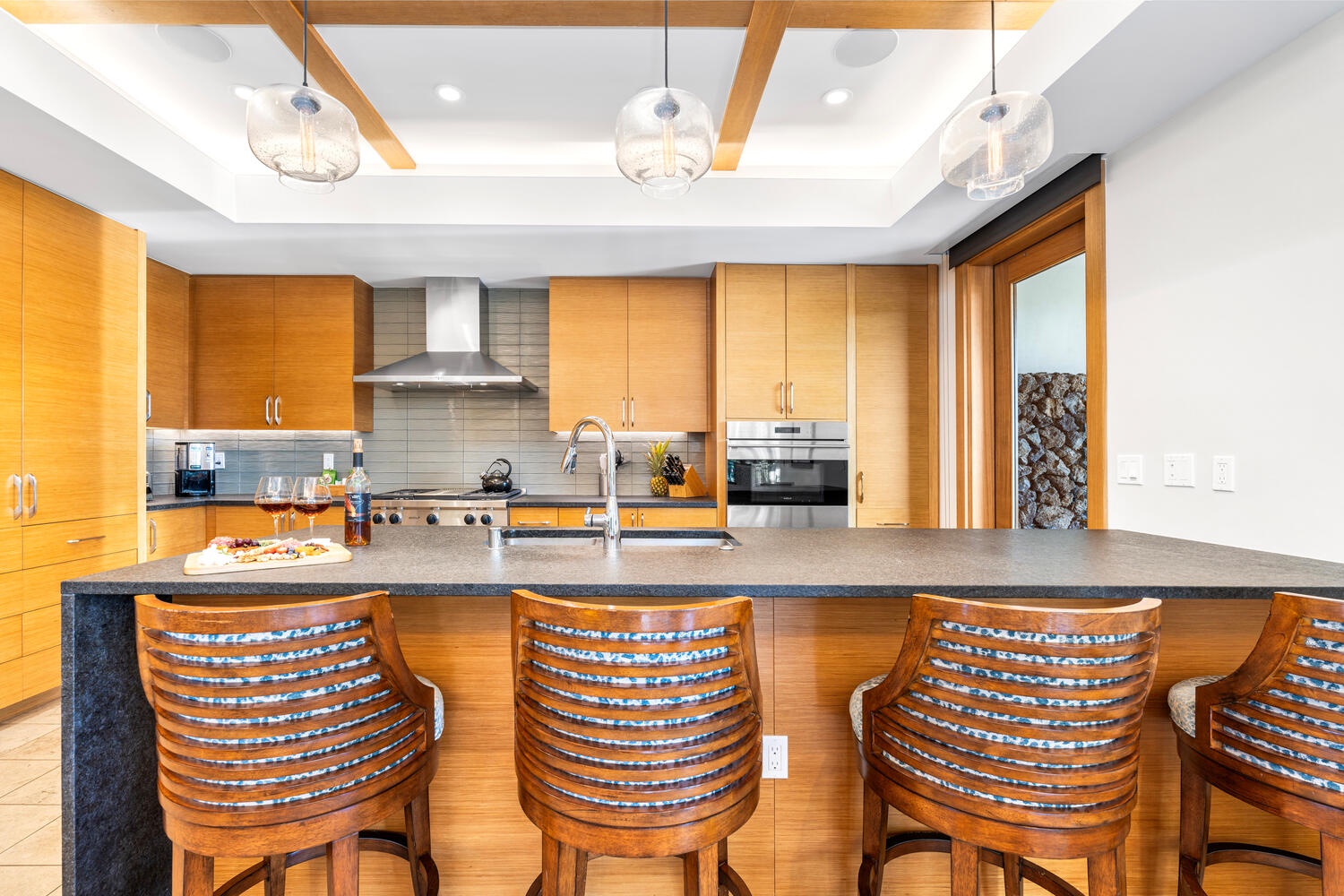 Kamuela Vacation Rentals, Laule'a at the Mauna Lani Resort #14 - The chef-ready kitchen includes high-end appliances and a bar for casual dining.
