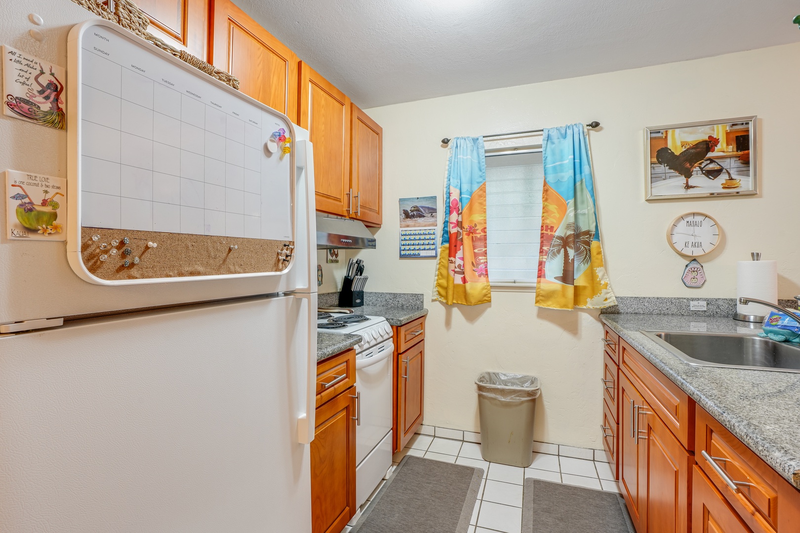 Kapaa Vacation Rentals, Nani Hale - Create island-inspired meals in a well-stocked kitchen with full-size appliances, cookware, and modern touches.