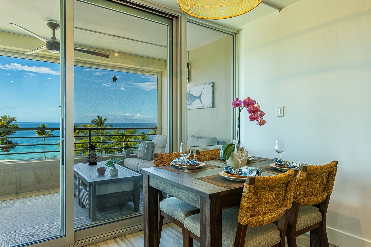 Kihei Vacation Rentals, Kamaole Beach Royal 610 - Dinner moves toward the sliders here, where the ocean view doesn't stop for dessert.