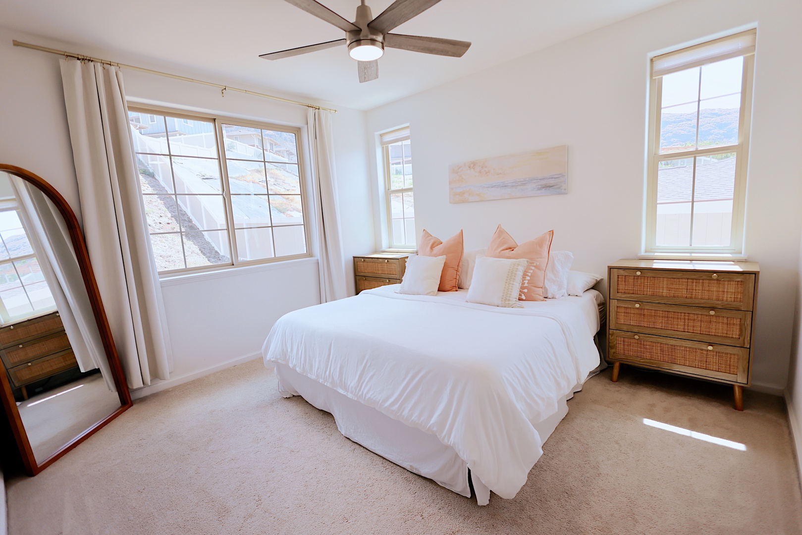 Makaha Valley Vacation Rentals, Makaha Vista Retreat** - Natural light and serene decor create a restful ambiance in this comfortable guest bedroom.