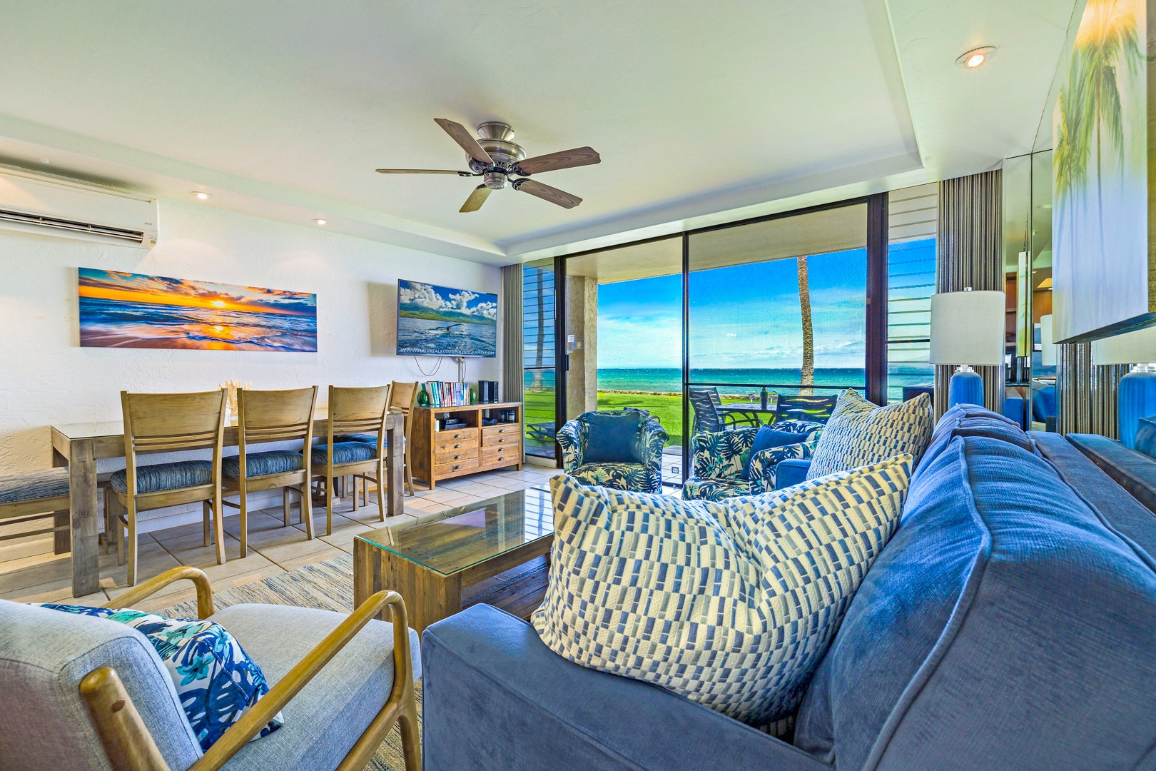 Lahaina Vacation Rentals, Papakea L-106 - A cozy living space with plush seating and large sliding glass doors leading to a breathtaking oceanfront view