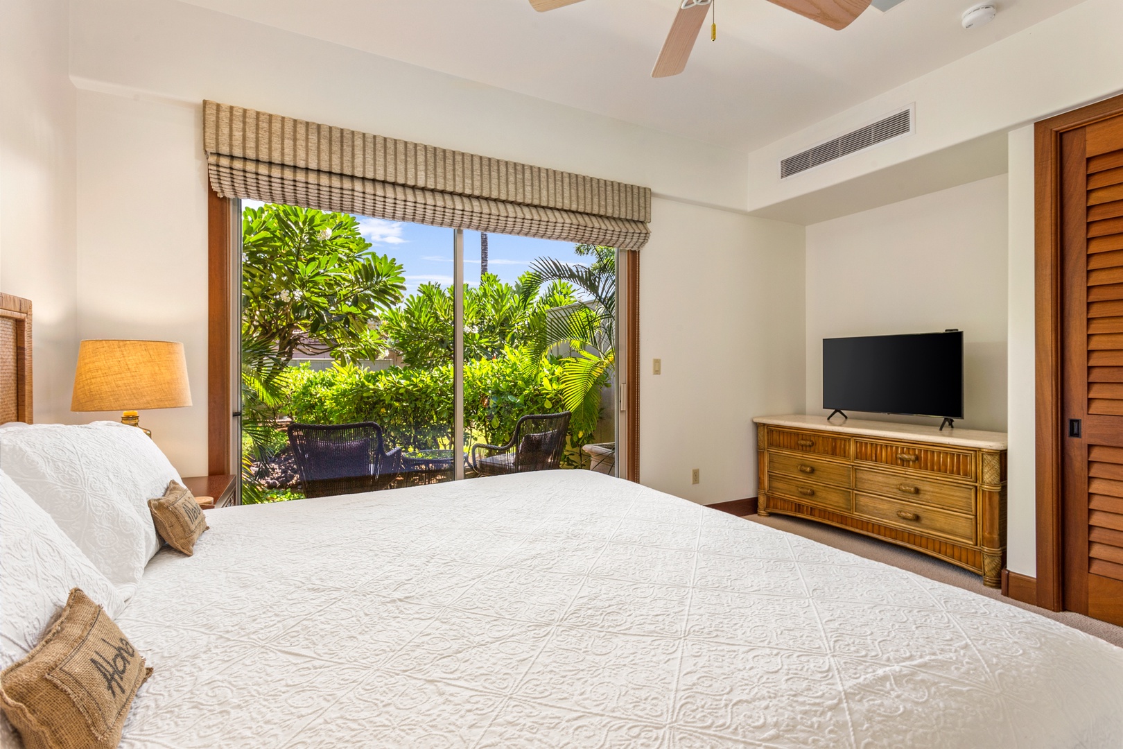 Kailua Kona Vacation Rentals, OFB 3BD Ka'Ulu Villa (129D) at Four Seasons Resort at Hualalai - Alternate view of second bedroom showcasing private patio and flatscreen television.