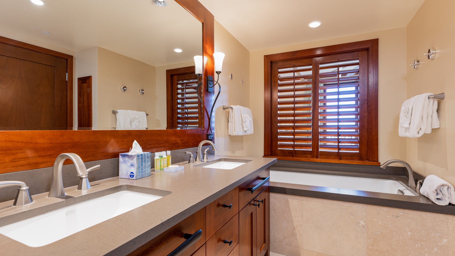 Kapolei Vacation Rentals, Ko Olina Beach Villas B701 - The primary guest bathroom features a luxurious soaking tub and walk-in shower.