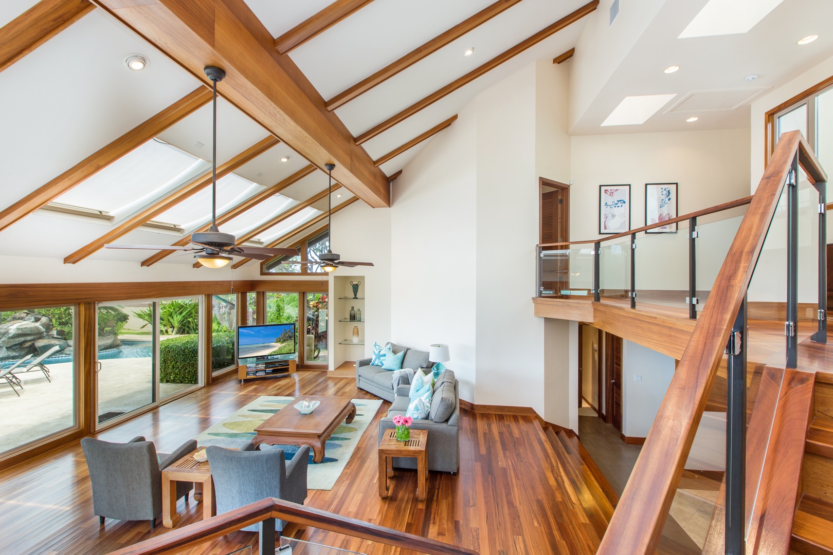 Honolulu Vacation Rentals, Kahala Mini Resort (5BR) - A staircase climbs past the great room to the bedrooms, sunlight following the open beams.