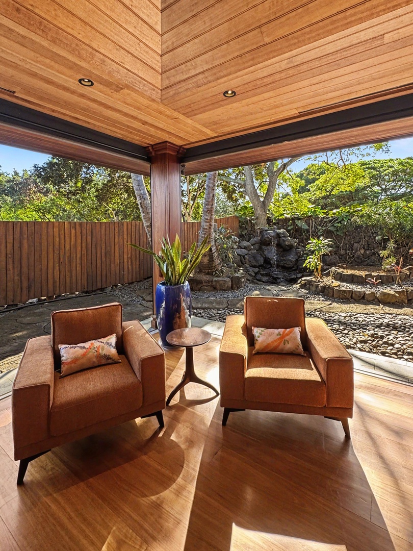 Kailua-Kona Vacation Rentals, Hahalua Bay Villa - Unwind in your private covered terrace where warm wood ceiling meets garden views, perfect for morning coffee or evening relaxation.
