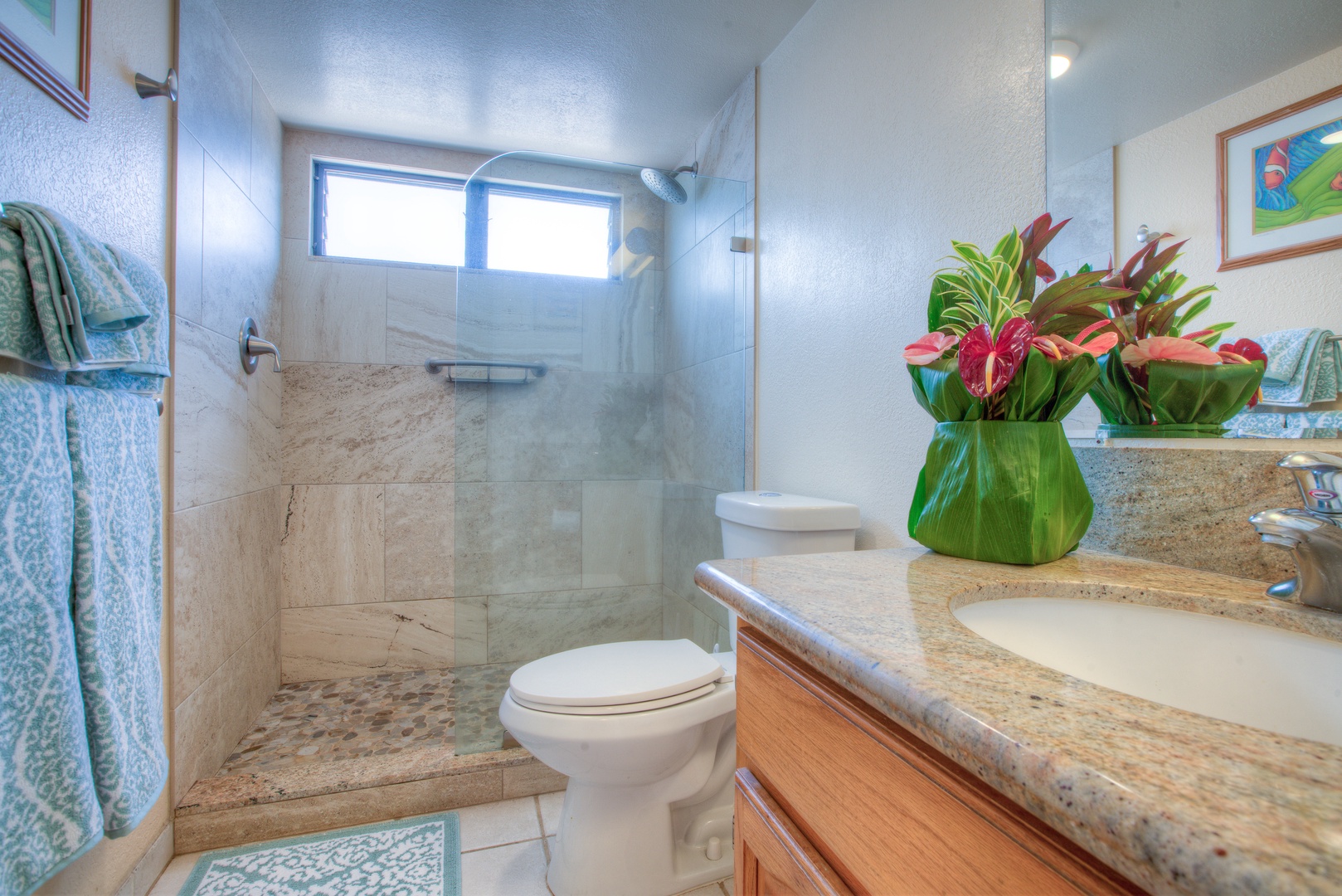 Kailua Kona Vacation Rentals, Kona Reef F11 - Bath has Granite Counter and a Glass Step-in Shower with River-Rock base.