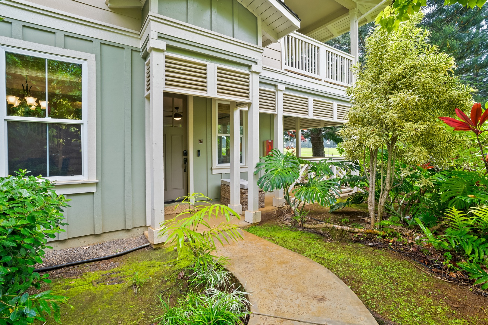 Princeville Vacation Rentals, Hale Kaua'i - A garden-lined walkway welcomes you into your private island home in Princeville.