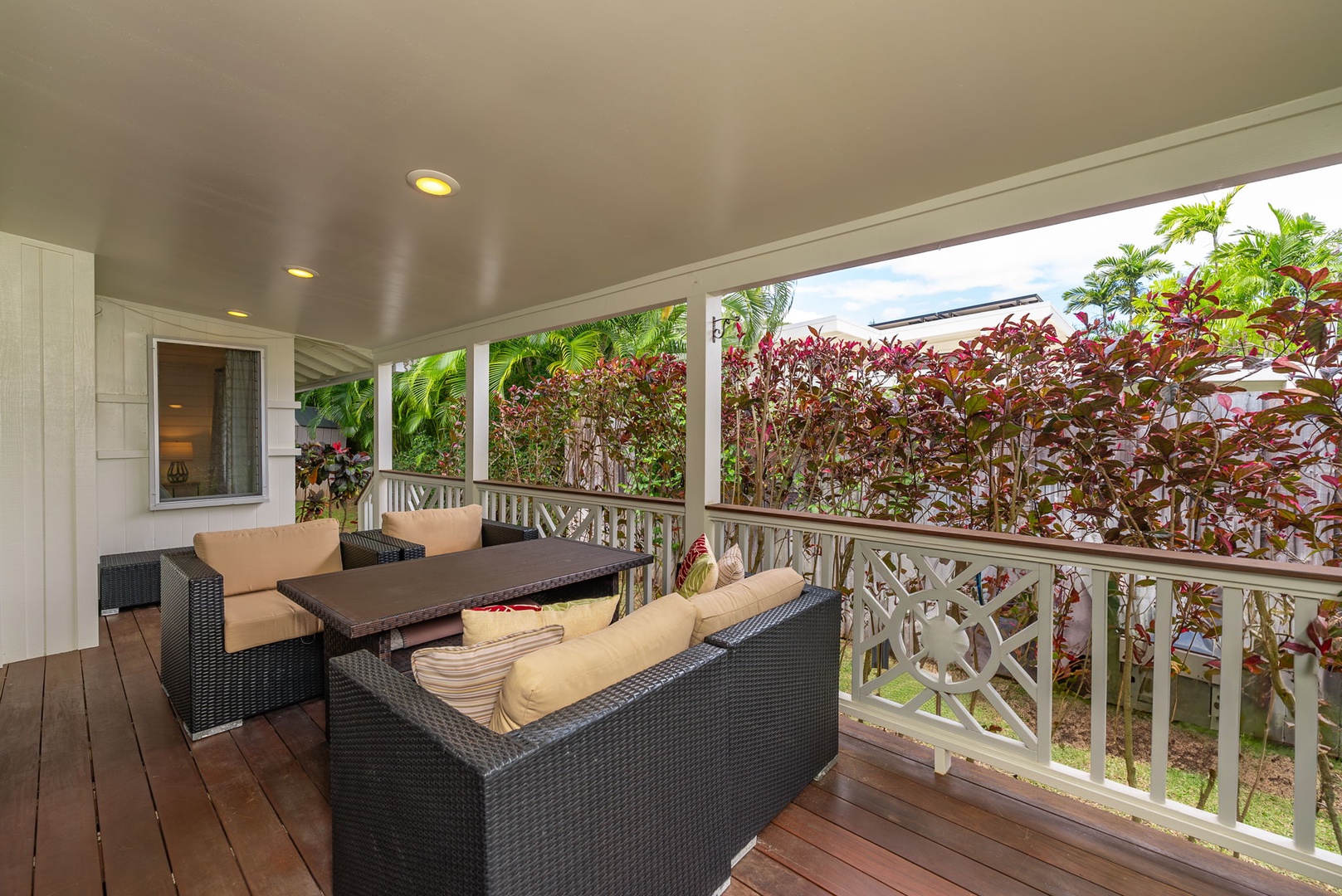 Kailua Vacation Rentals, Nohie Lanikai - Unwind on the covered lanai with plush seating and a view of tropical greenery.