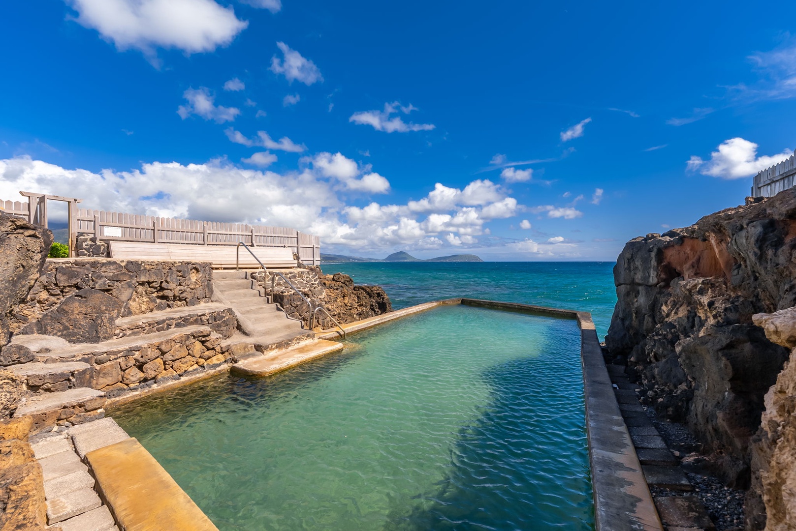 Honolulu Vacation Rentals, Black Point Ocean Villa - Natural ocean pools carved into volcanic rock create a unique swimming experience with crystal-clear waters and dramatic coastal views.