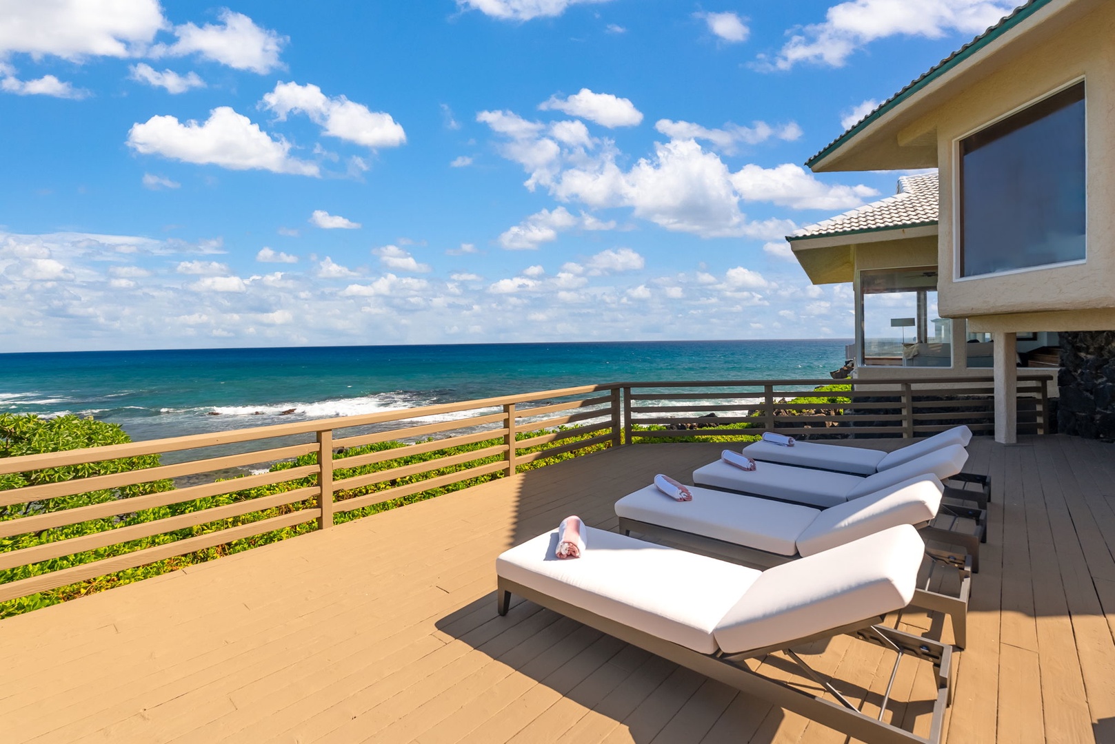 Honolulu Vacation Rentals, Black Point Ocean Villa - Plush loungers on your private deck, where ocean waves meet golden sand just steps away.