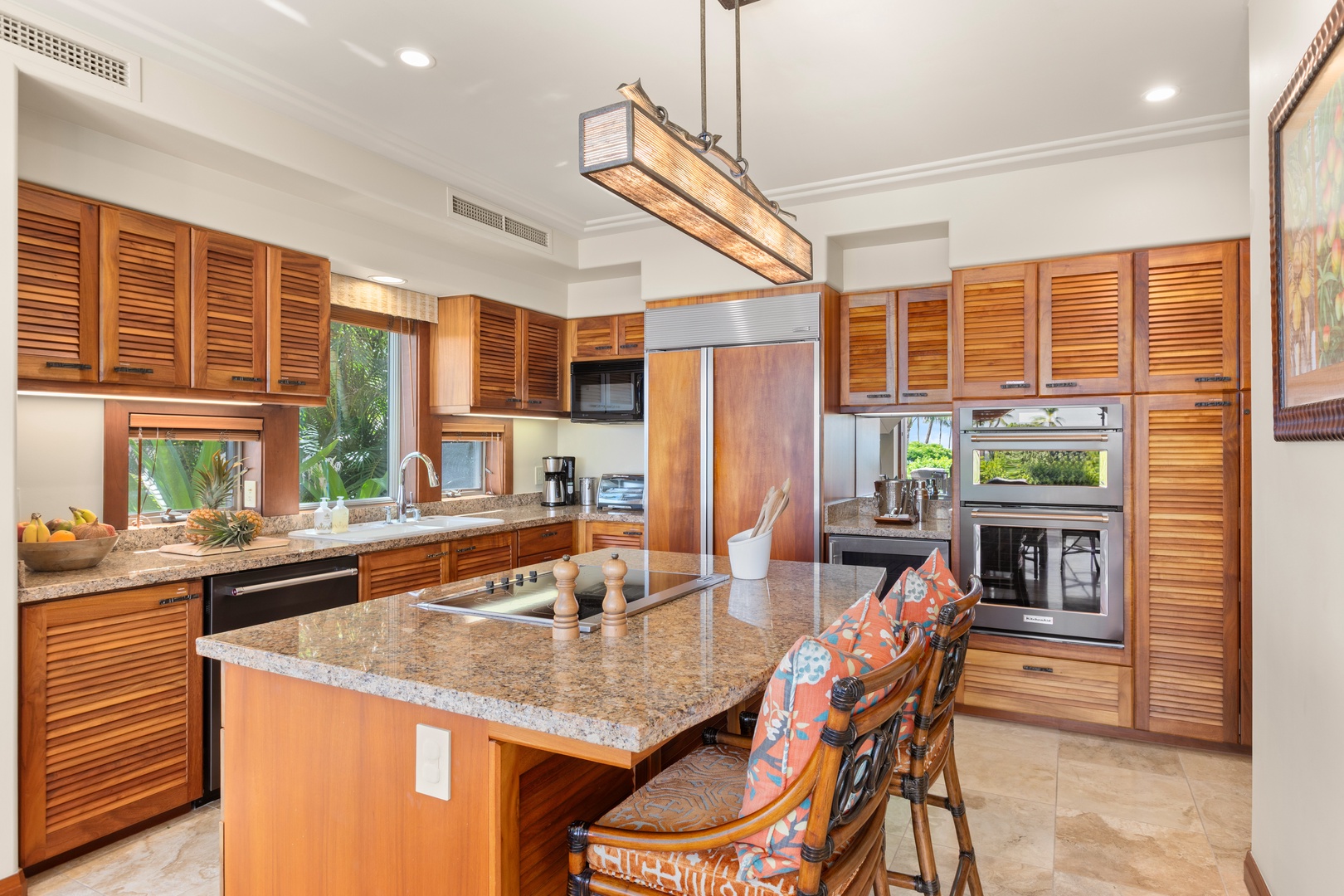 Kailua Kona Vacation Rentals, 2BD Hillside Villa (4102) at Hualalai Resort - Spacious kitchen island with pendant lighting and bar seating for casual meals.