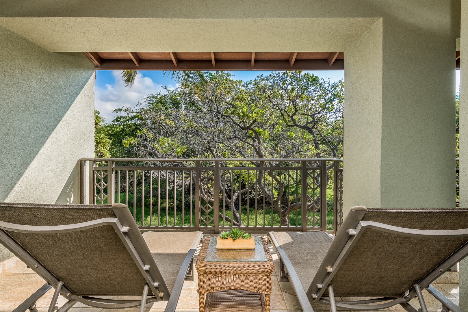 Kamuela Vacation Rentals, Mauna Lani Fairways #204 - Your private balcony off the primary suite invites you to sit back, relax, and soak up serene greenbelt and treetop views.