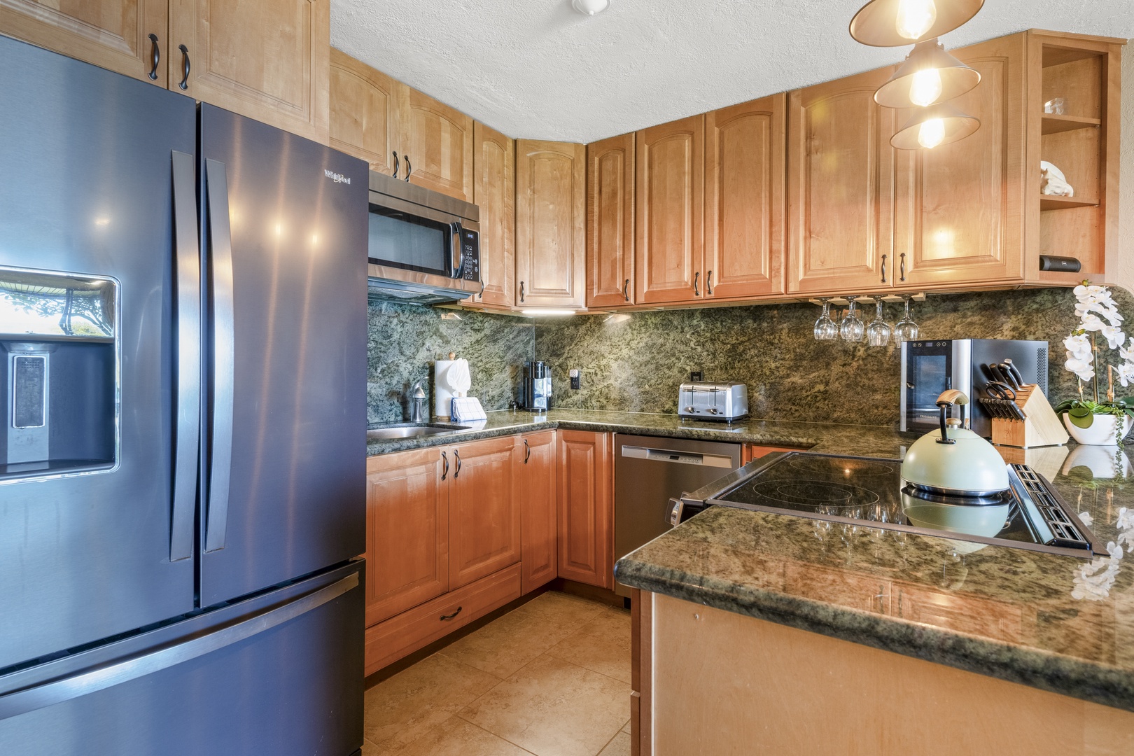 Lahaina Vacation Rentals, Polynesian Shores 114 - A full kitchen with stone counters and full-size appliances, everything you need to cook for the group.