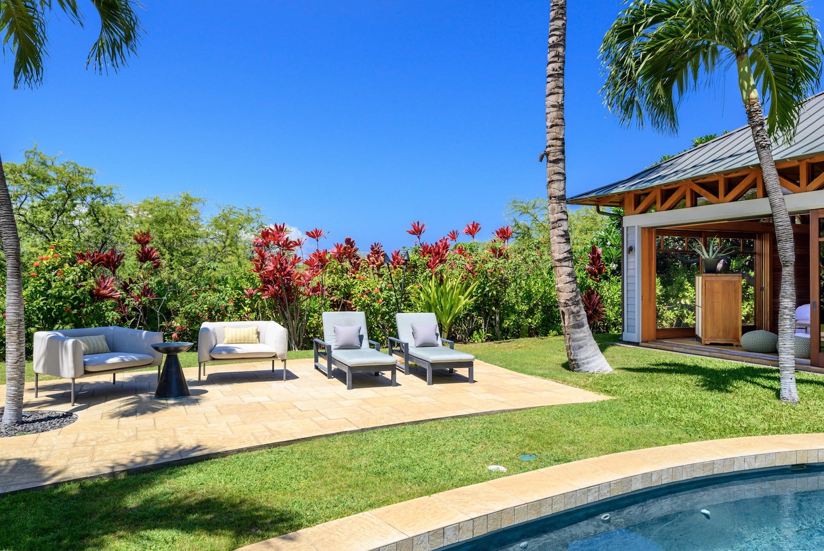 Kamuela Vacation Rentals, 3BD Na Hale 3 at Pauoa Beach Club at Mauna Lani Resort - The lounge area by the poolside is a perfect spot for a chilled drink.