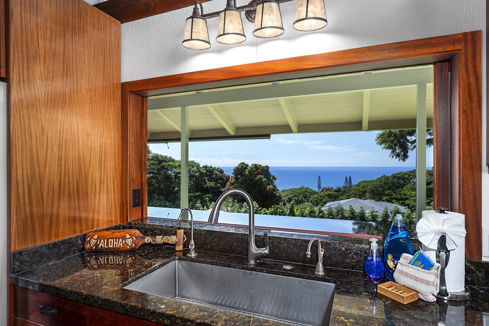 Kailua-Kona Vacation Rentals, Hale Joli - Cook with a serene poolside backdrop.