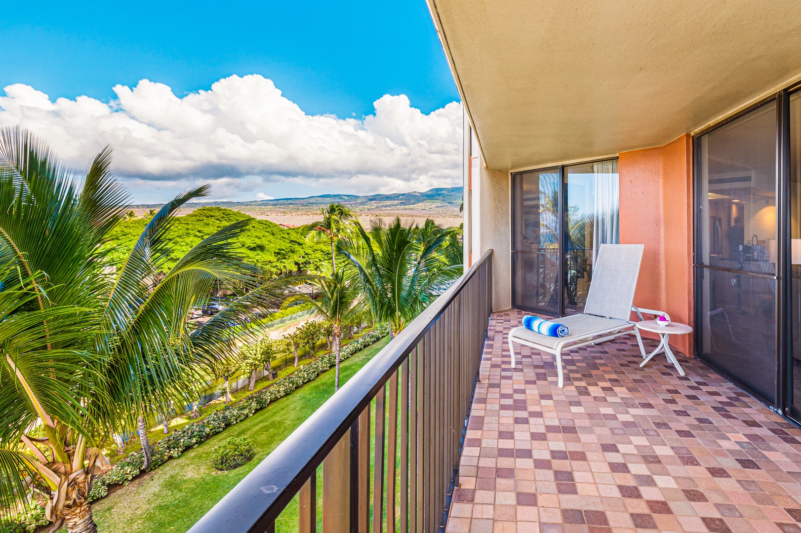 Lahaina Vacation Rentals, Kaanapali Shores 502 - Unwind on the spacious lanai, where the lush greenery meets the blue skies, creating a tranquil space to enjoy your morning coffee or an afternoon breeze.