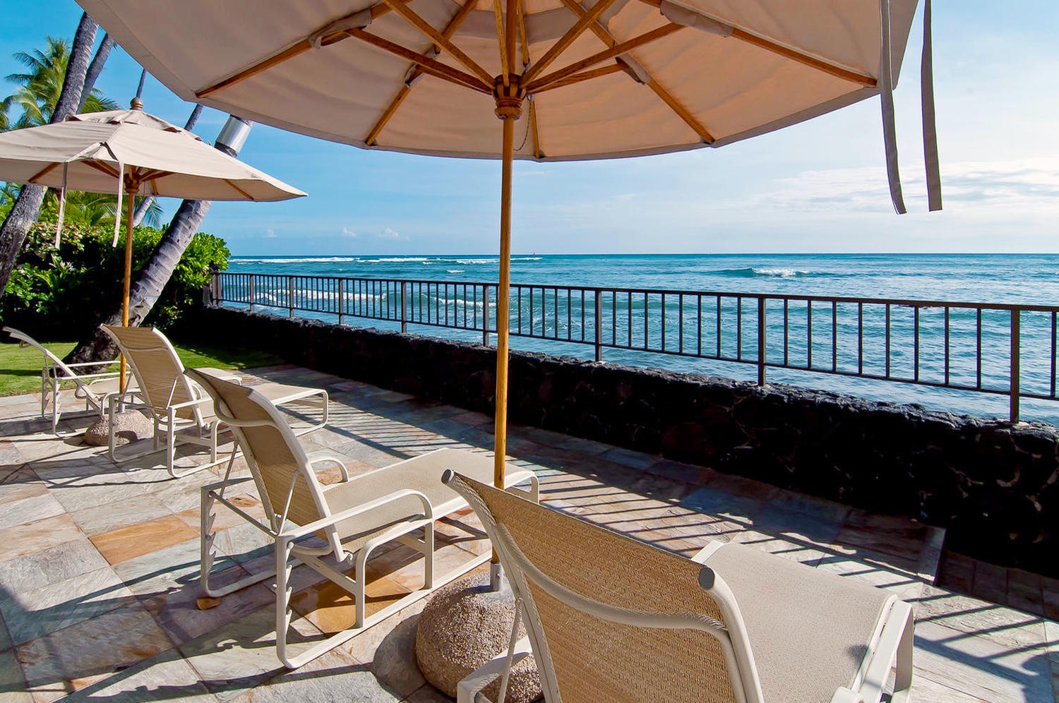 Honolulu Vacation Rentals, Executive Gold Coast Oceanfront Suite - Enjoy sunbathing on the oceanfront deck.