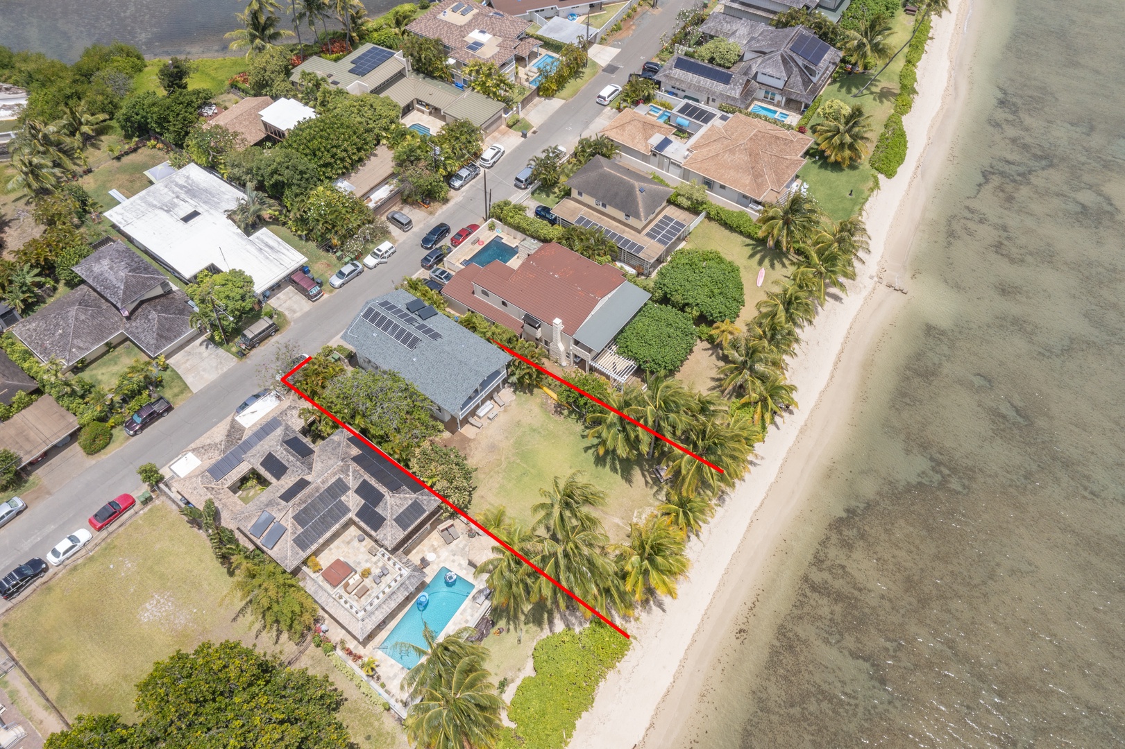 Honolulu Vacation Rentals, Honolulu Beachfront Retreat - Close aerial perspective of the property with clear boundaries and beach access.