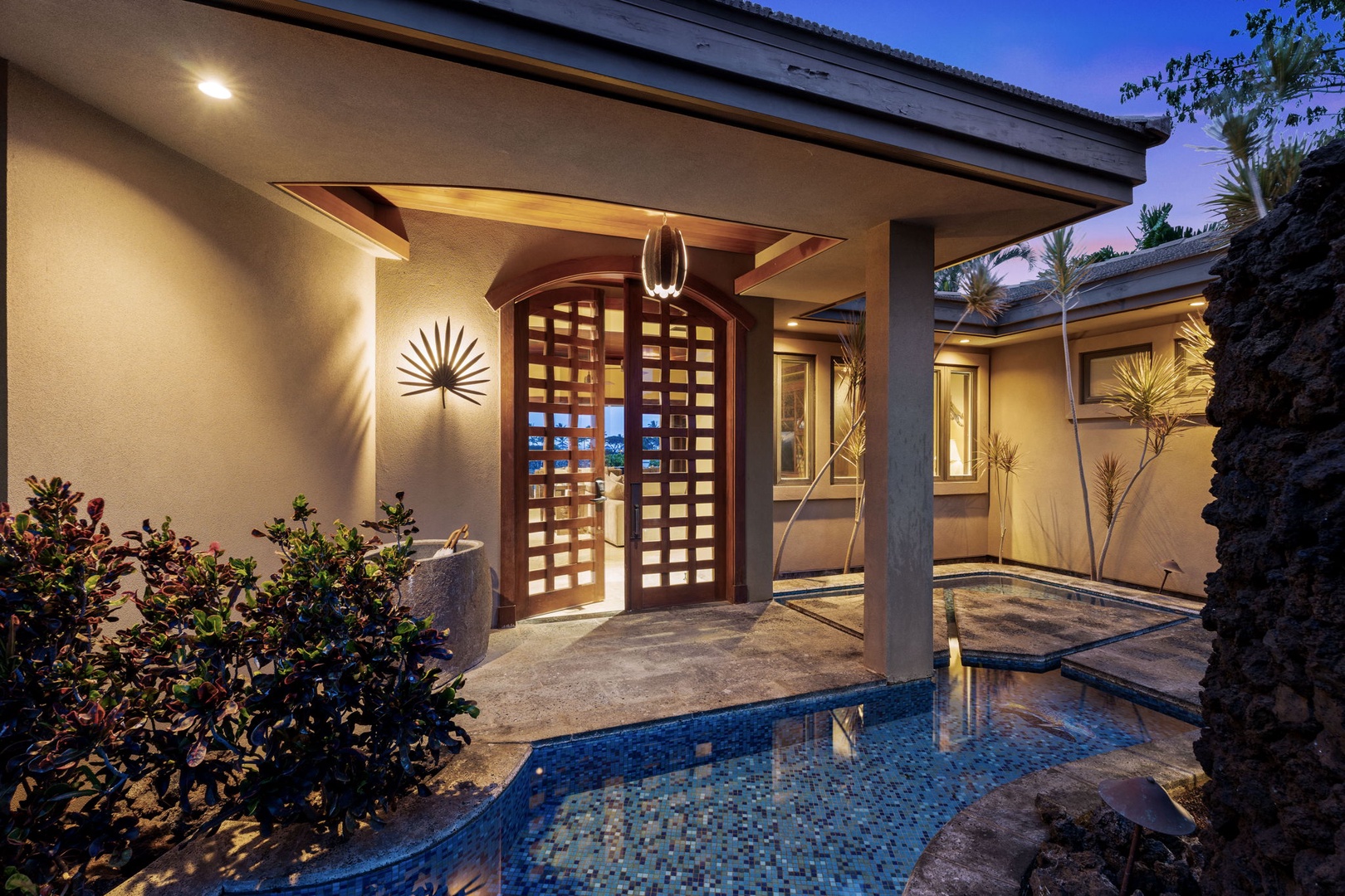 Kamuela Vacation Rentals, Hale Konane - A warm twilight welcome awaits, framed by soft lighting and serene island charm.