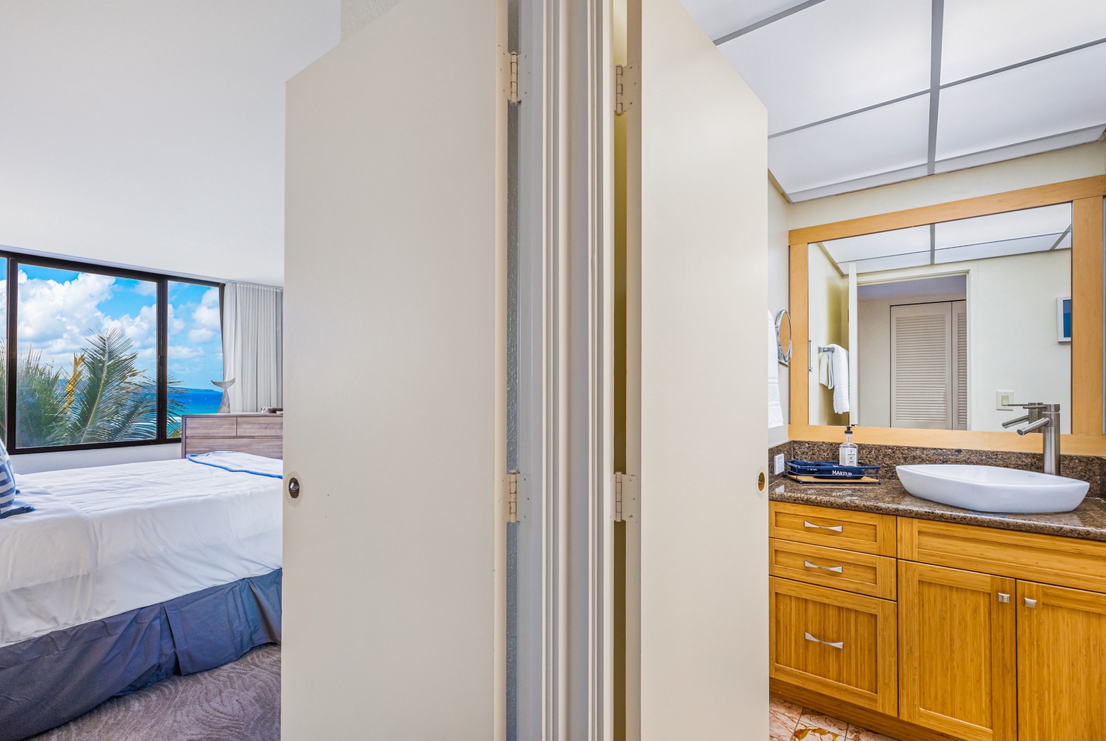 Lahaina Vacation Rentals, Kaanapali Shores 502 - The bathroom is conveniently located adjacent to the bedroom, providing easy access for guests.