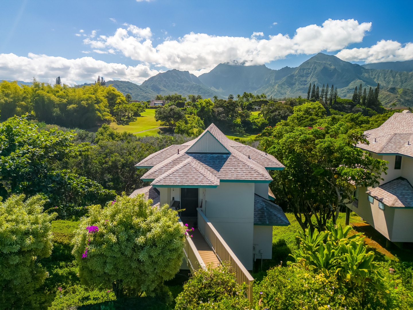 Princeville Vacation Rentals, Makanalani - Idyllic home nestled among green landscapes, offering tranquility and panoramic mountain vistas—a haven of peace and natural beauty.