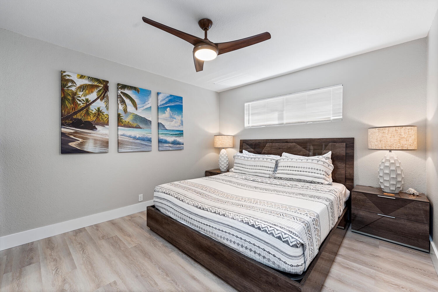 Kailua Kona Vacation Rentals, Hale Kai O'Kona #7 - Downstairs Junior primary with king bed and vibrant island artwork.