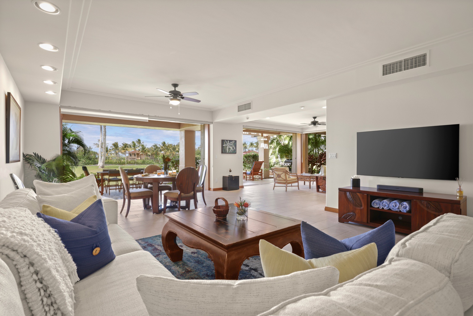 Kailua Kona Vacation Rentals, 3BD Golf Villa (3101) at Hualalai Resort - Elegant living area with sliding glass pocket doors to lanai seating and ocean views.