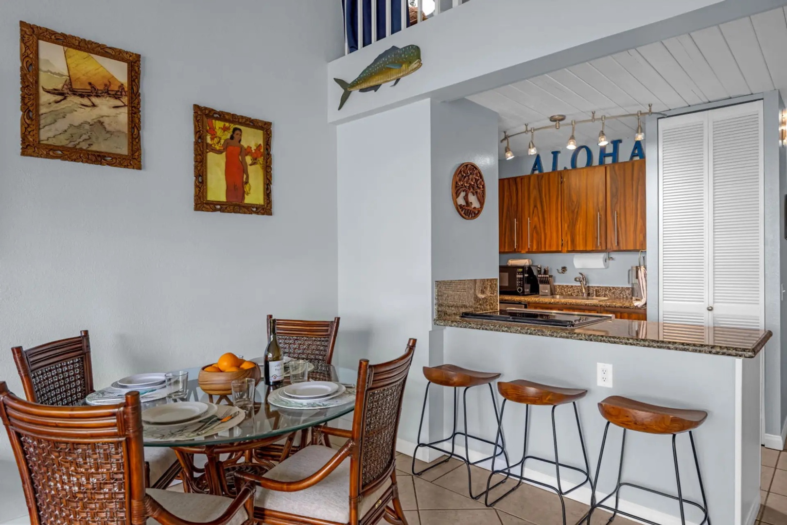 Kihei Vacation Rentals, Maui Vista 2420 - Dinner for four at the glass table, the bar and kitchen an arm's reach behind.