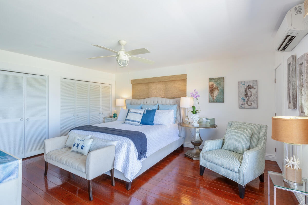 Princeville Vacation Rentals, Hokulani Villa - The primary bedroom  has a Cal king-sized bed, ensuite bathroom and split AC.