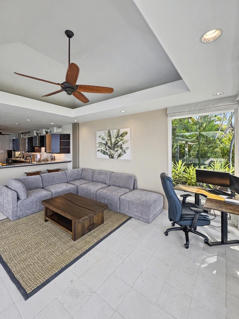 Kailua Kona Vacation Rentals, Hale Nai'a - Relaxed living area with garden views and flexible space for work or lounging.