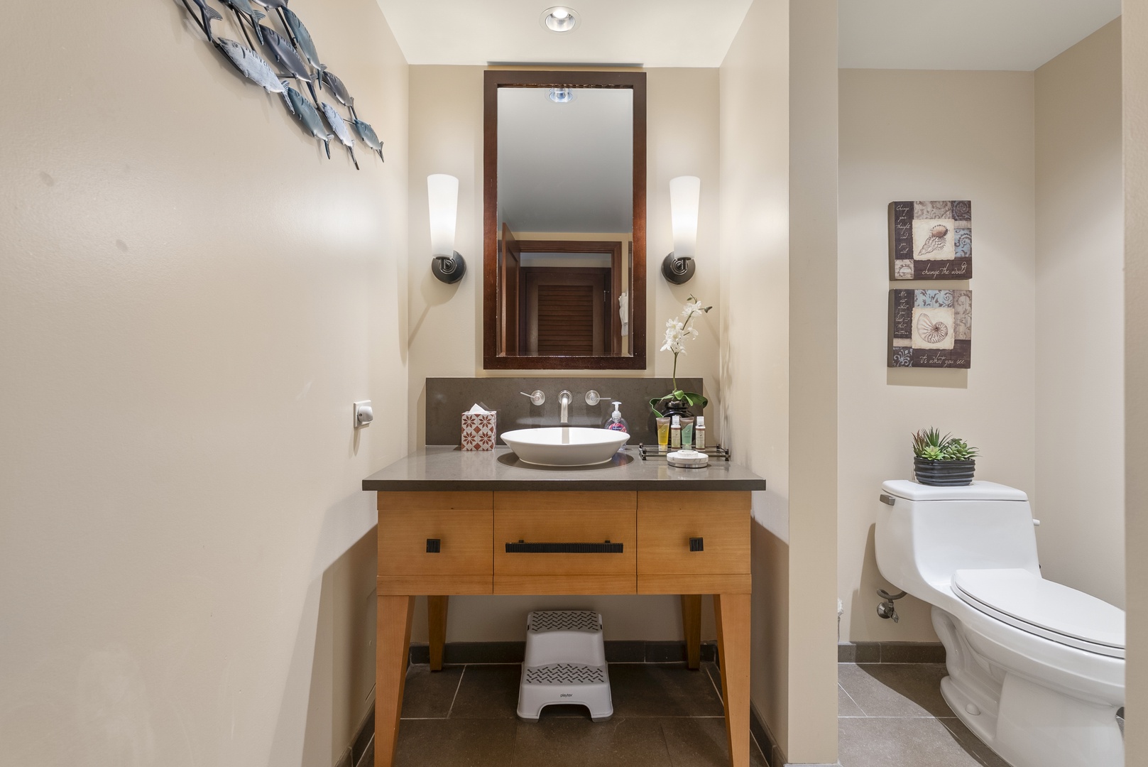 Kapolei Vacation Rentals, Ko Olina Beach Villas O1404 - Get ready for dinner at the vessel-sink vanity, sconces framing the mirror.