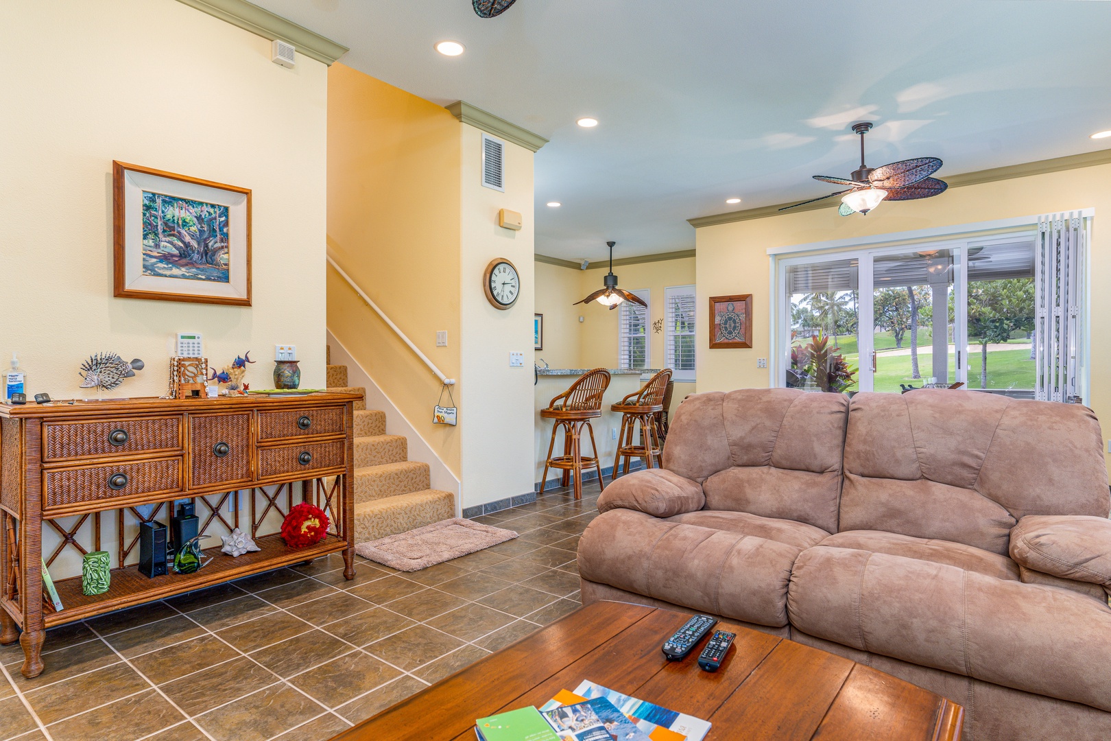 Kapolei Vacation Rentals, Coconut Plantation 1100-2 - A picture showing the stairs in the condo and the bar seating in the kitchen.