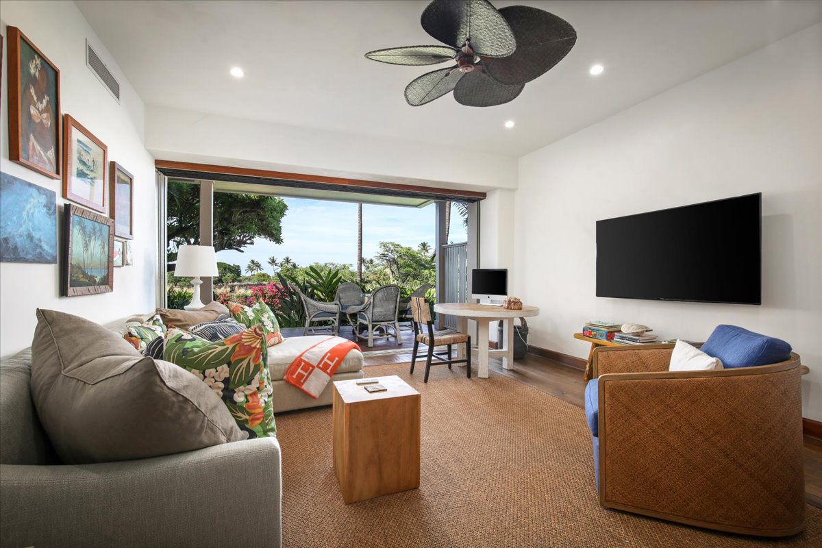 Kailua Kona Vacation Rentals, 3BD Ka'ulu Villa (129B) at Hualalai Resort - Seamless indoor-outdoor living in the family den with a sliding glass pocket door that leads to the lanai.