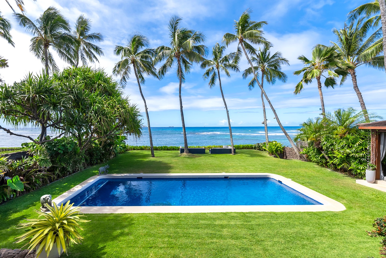 Honolulu Vacation Rentals, Diamond Head Beachfront Estate - Private pool framed by swaying palms and manicured lawn, steps from the turquoise ocean—an idyllic oceanfront escape awaits.