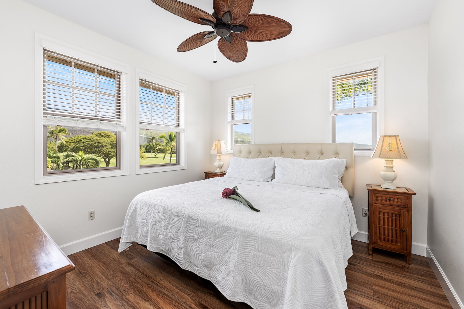 Kailua Kona Vacation Rentals, Holua Moana Hale - Upstairs guest bedroom with a king-sized bed, AC, and TV.