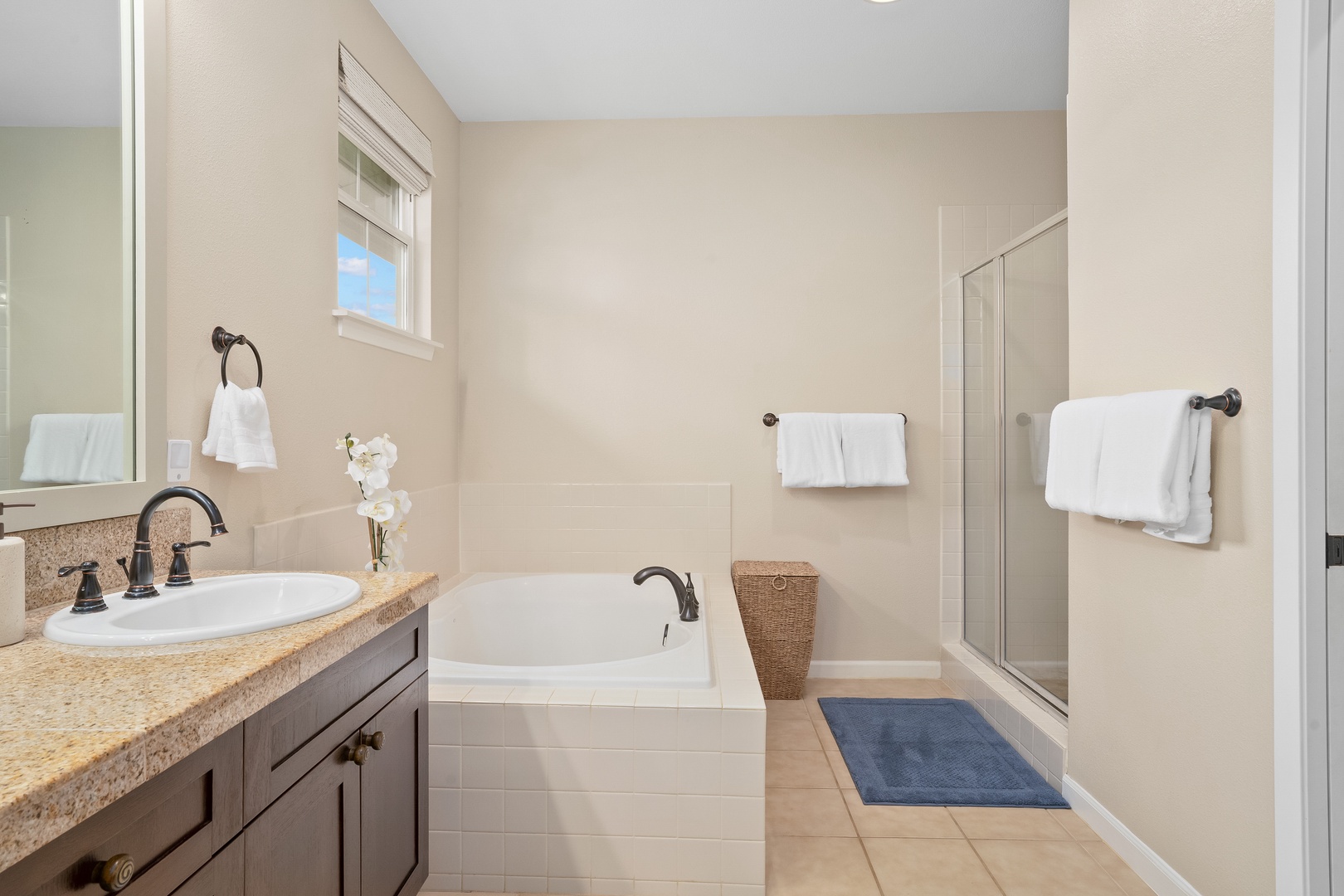 Princeville Vacation Rentals, Hale Kaua'i - Refresh after beach days in this bright bathroom designed for comfort and relaxation.