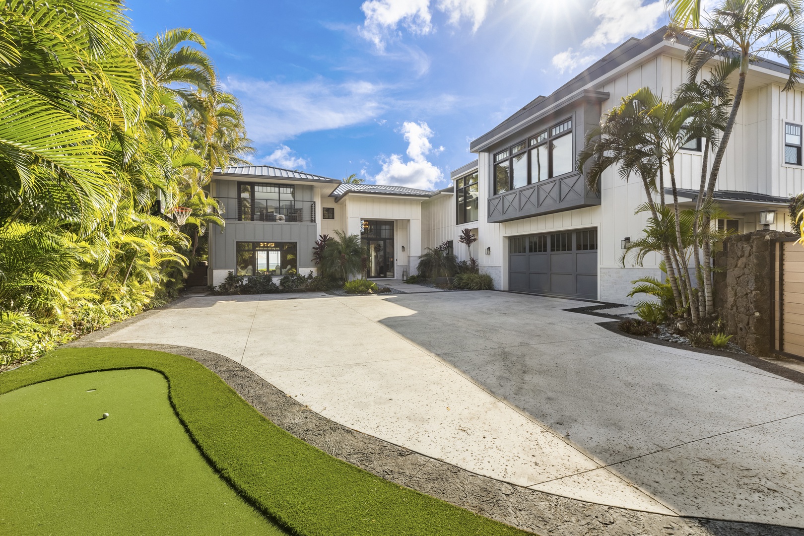 Honolulu Vacation Rentals, Niu Beach Estate - Ample driveway space for cars as well as a large garage. The entire home comes with air conditioning for optimal temperature control and comfort.