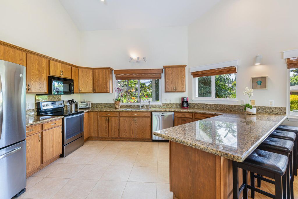 Princeville Vacation Rentals, Hale Cassia - The fully-stocked kitchen with stainless steal appliances is spaciously designed to make meal prep a breeze